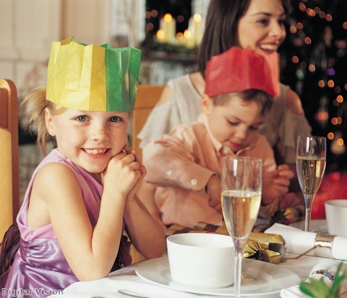 Children receive paper gift bags
